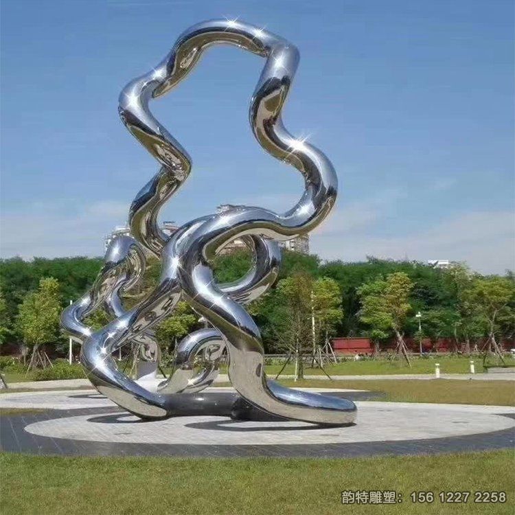 廣場(chǎng)不銹鋼鏡面飄帶雕塑，扭曲飄帶絲帶雕塑造型
